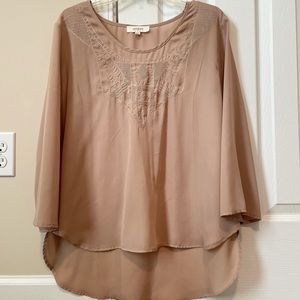 Light tan tunic. Size L.
